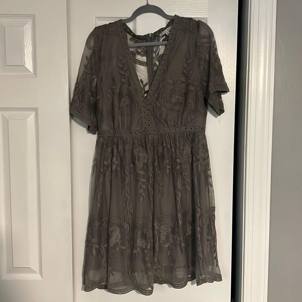 Grey lace, knee length dress.